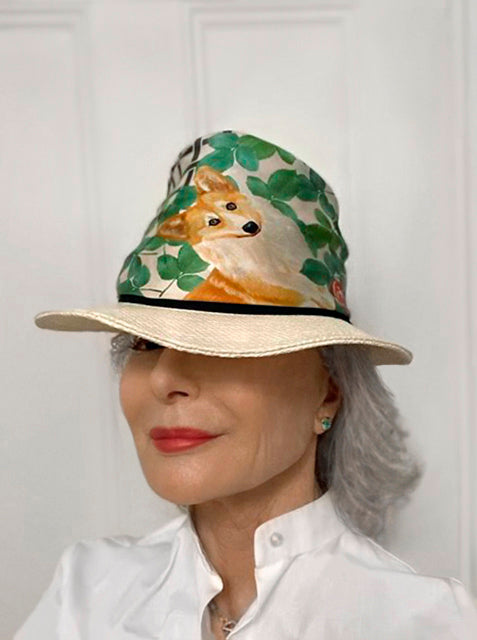 Mature model and equestrian, Deborah Sutherland is wearing Corgi over her hat.